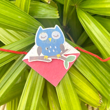 Load image into Gallery viewer, Blue Owl on a Branch: Kids 3-in-1 Bookmark Plantable Rakhi with Roli Chawal Combo
