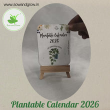 Load and play video in Gallery viewer, Plantable Calendar 2026 with Seeds in Every Page | Colourful Floral Design | Eco-Friendly with Wooden Easel | 2 Varieties of Flower Seeds
