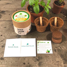 Load image into Gallery viewer, Sow and Grow® mini grow kit with tomato and Italian basil seeds, biodegradable pots, and soil discs on wooden table
